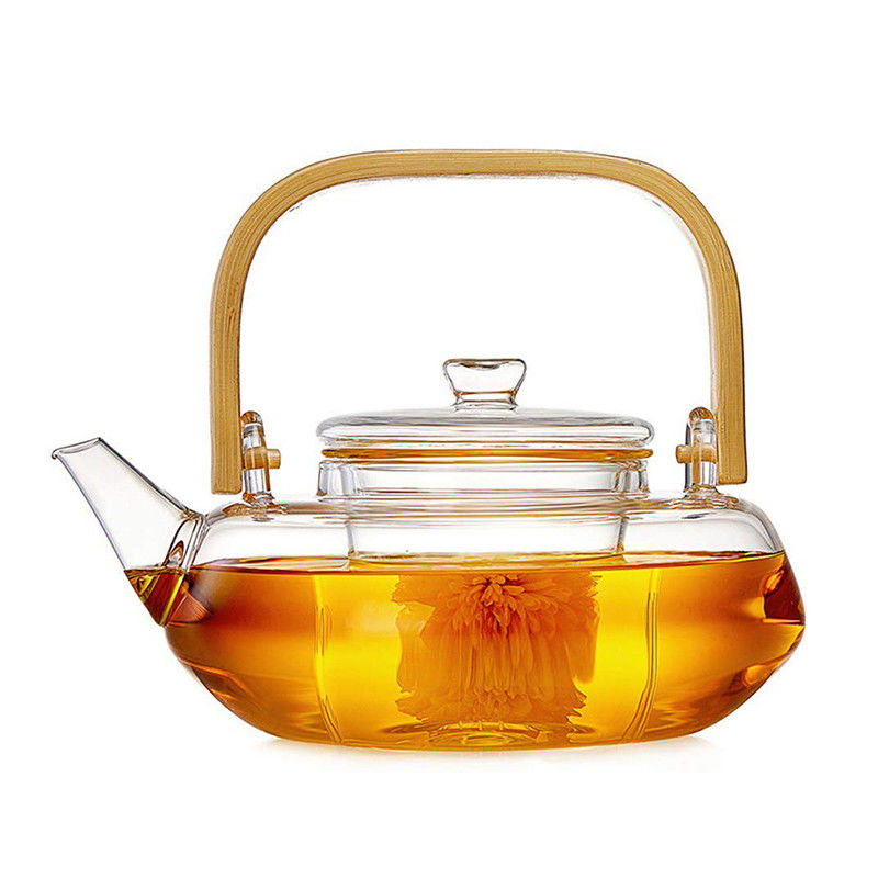 フィルター、やかんと置かれる手によってが付いている透明な咲く茶鍋吹かれるティー カップ サプライヤー