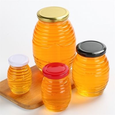 蜂の形は少しガラスの瓶、ふたが付いているガラス瓶のあたりで通されて空想します サプライヤー